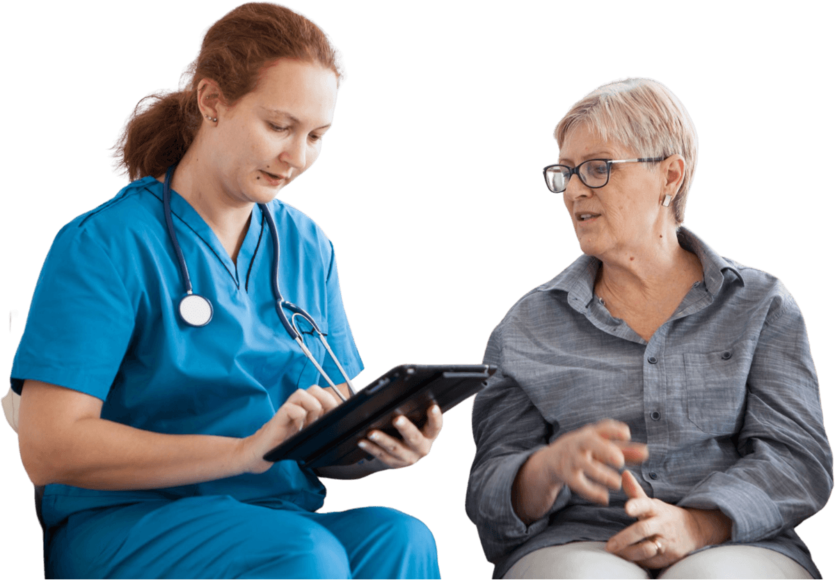 A nurse reviewing a care plan on a tablet with a client